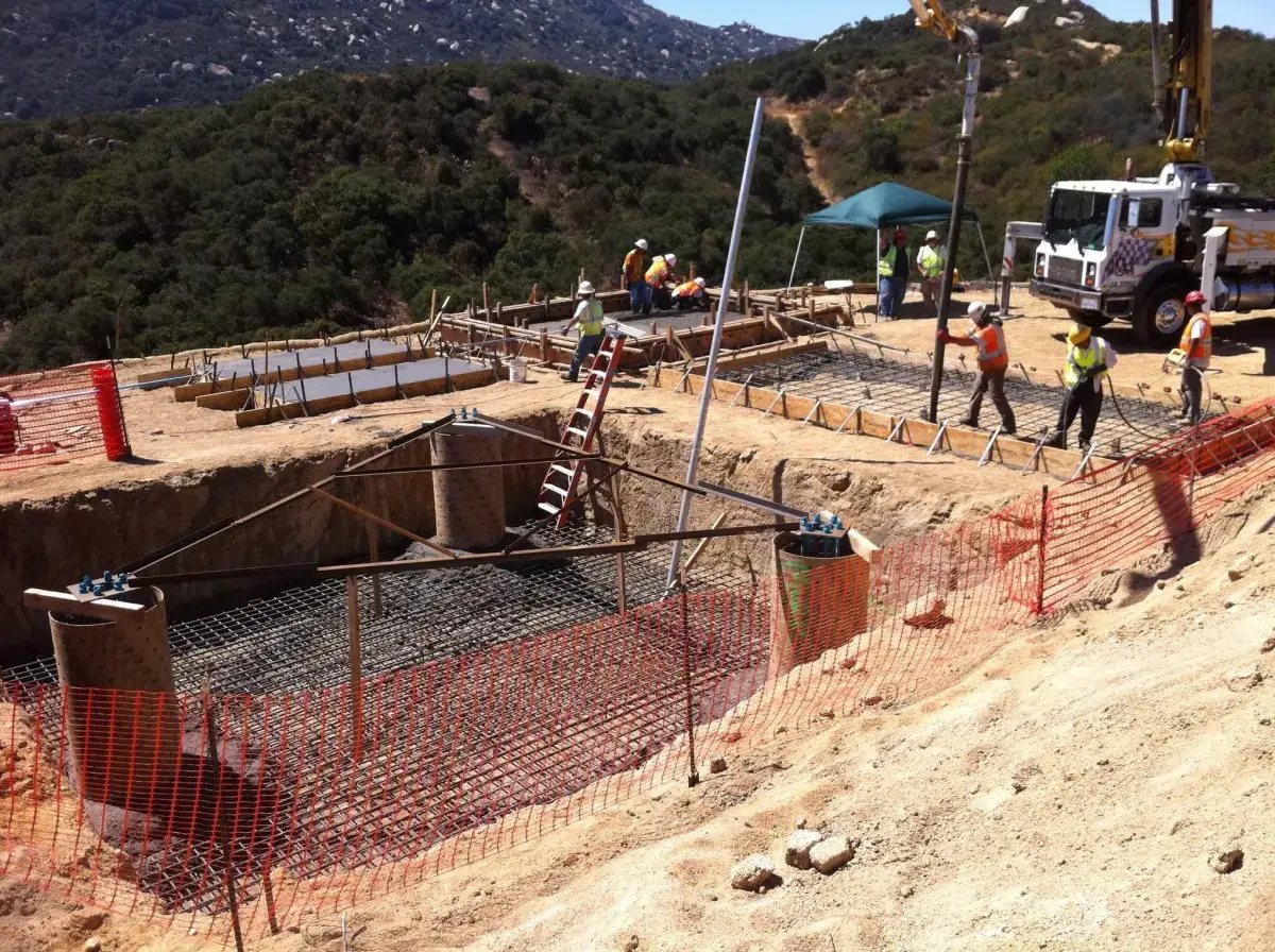 Concrete pump placing a slab at a commercial building