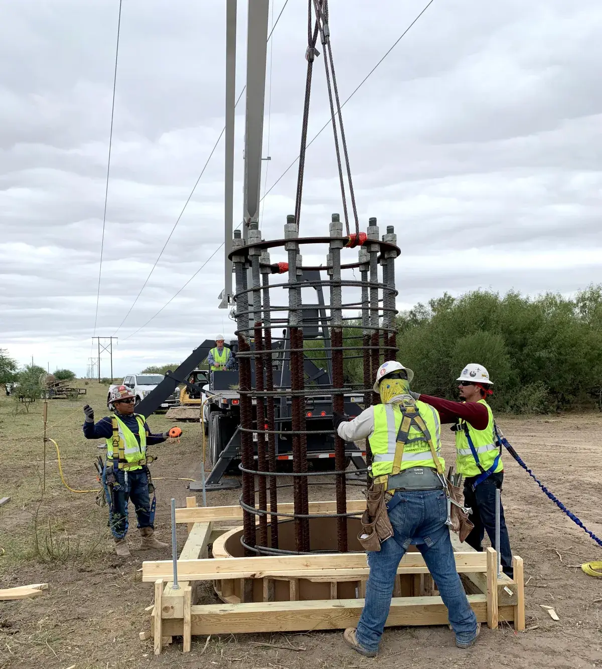 Crew setting a rebar cage for a drilled pier