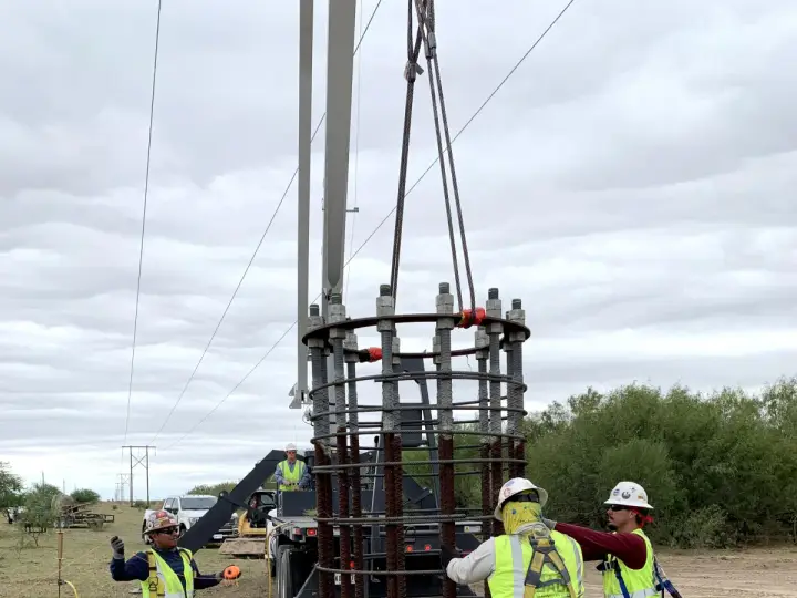 Crew setting a rebar cage for a drilled pier