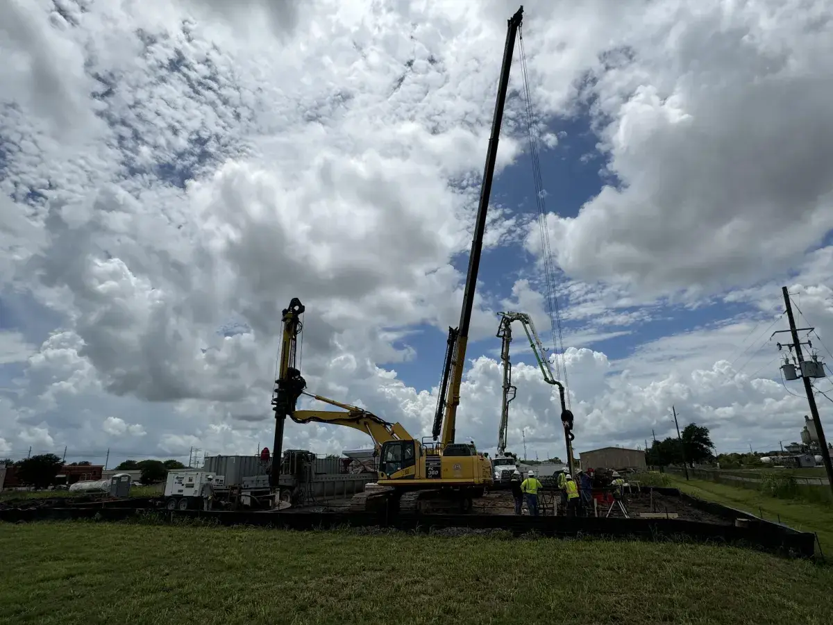 Drill rig and crane on a foundation site