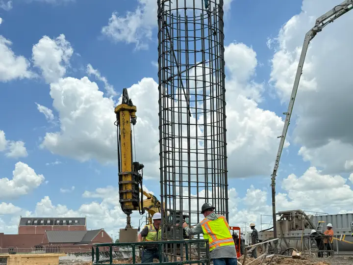 Guiding the cage into the shaft — Relentless Civil Construction jobsite