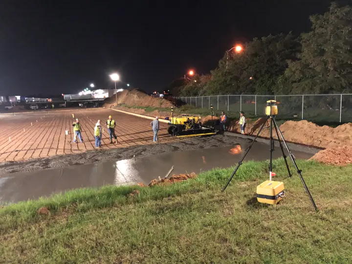 Screeding the deck — night shift — Relentless Civil Construction jobsite