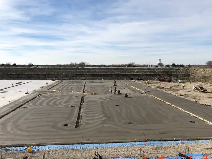 Broom-finished slab, curing — Relentless Civil Construction jobsite