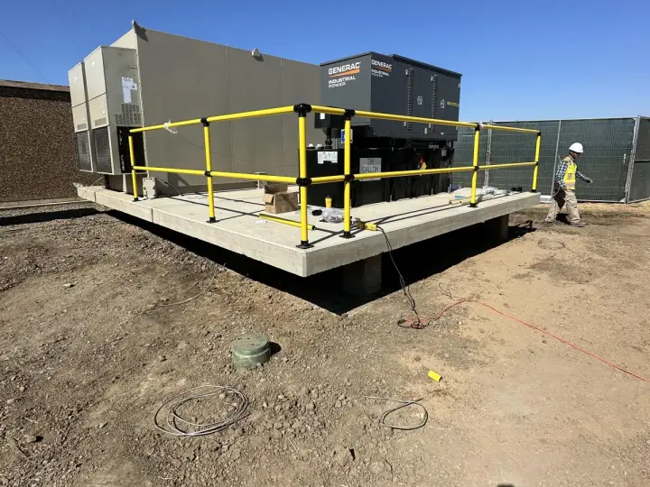 Skid set on housekeeping pad — Relentless Civil Construction jobsite