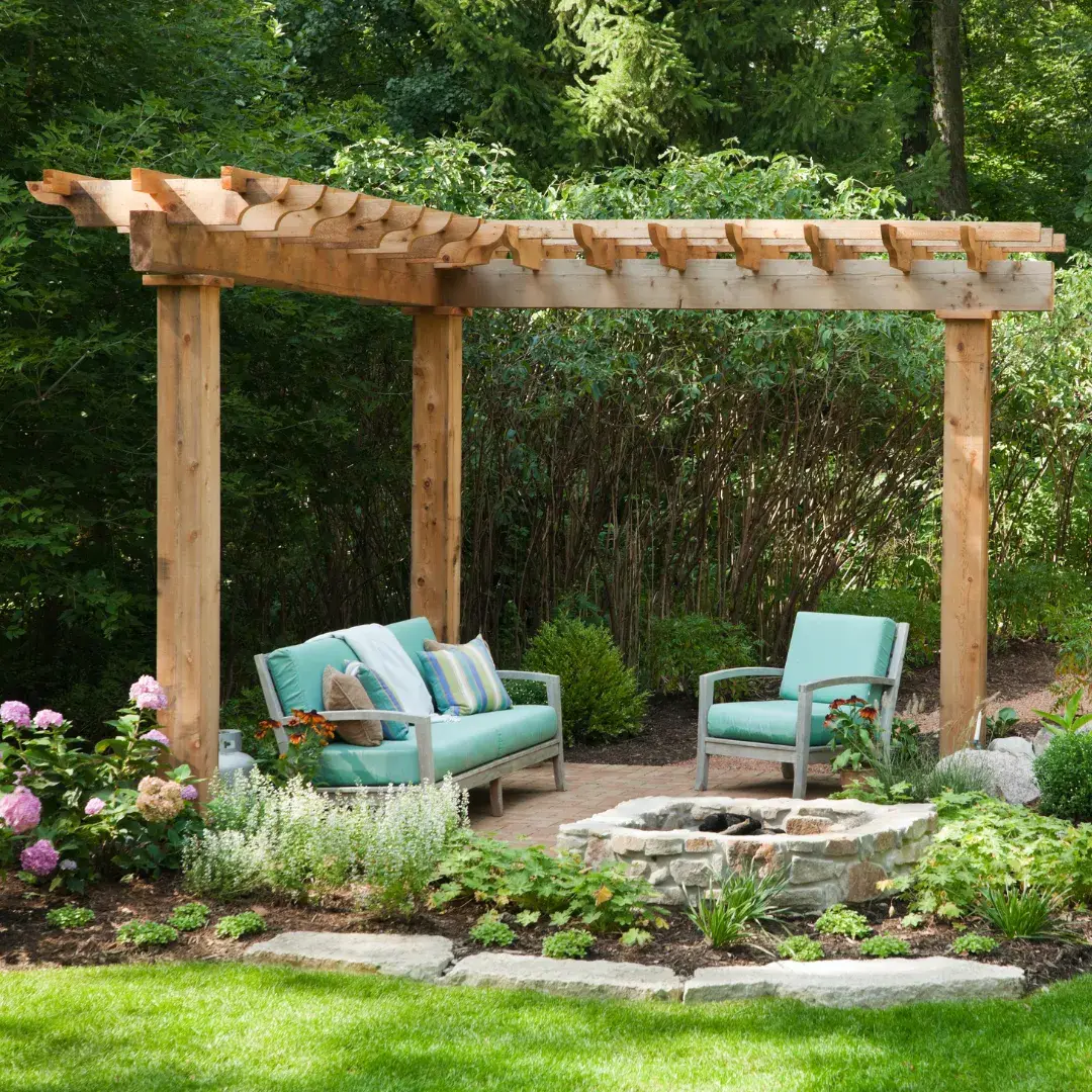 Backyard patio with pergola and stone fire pit